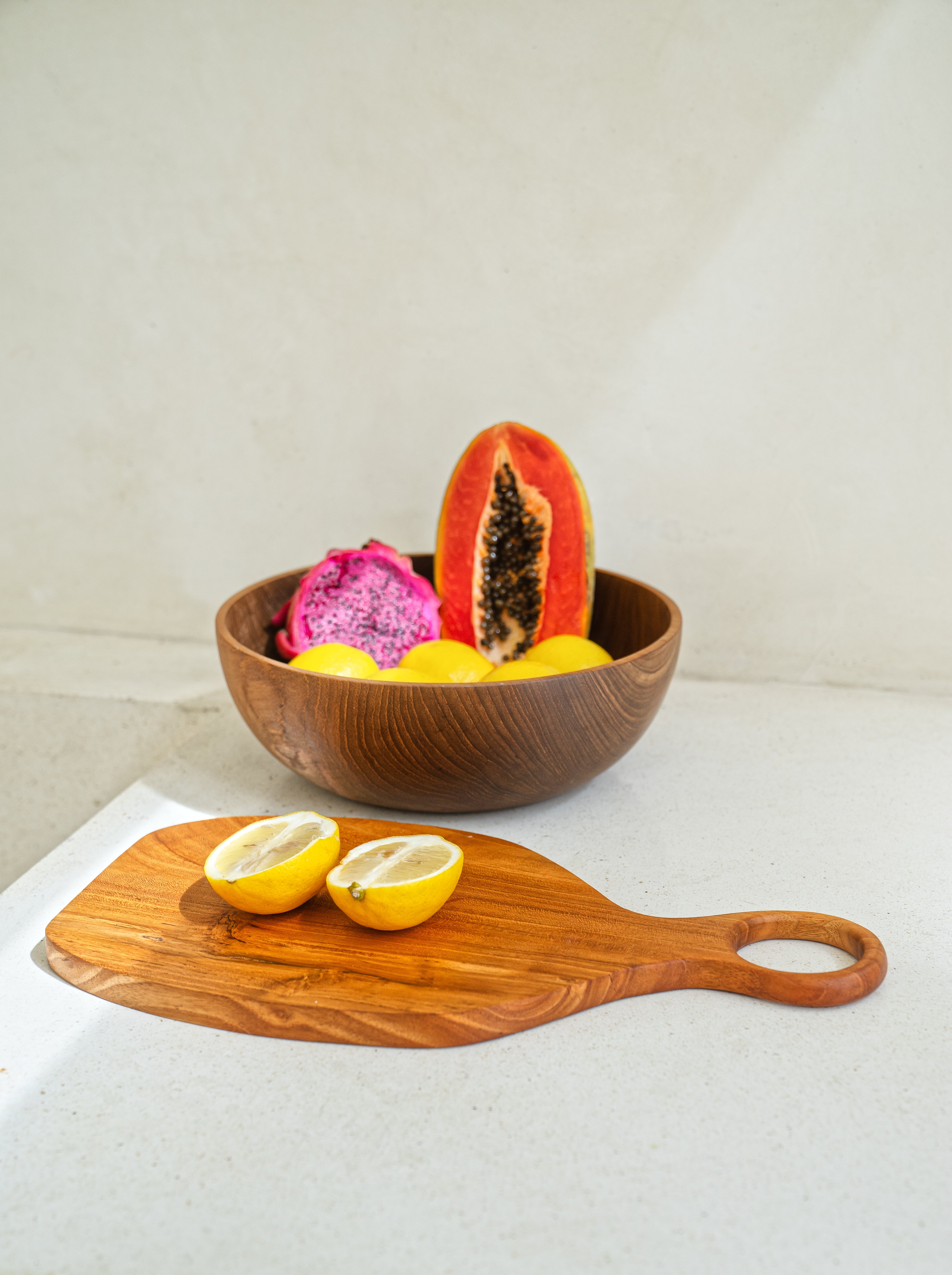 Kitchen and Dining Tableware All Handcrafted In Bali Indonesia. Teak wood bowls, cups, cutting boards, serving spoons and trays.