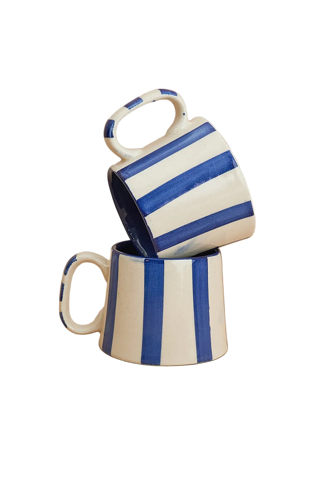 Two ceramic mugs with blue and white stripes on a beige background
