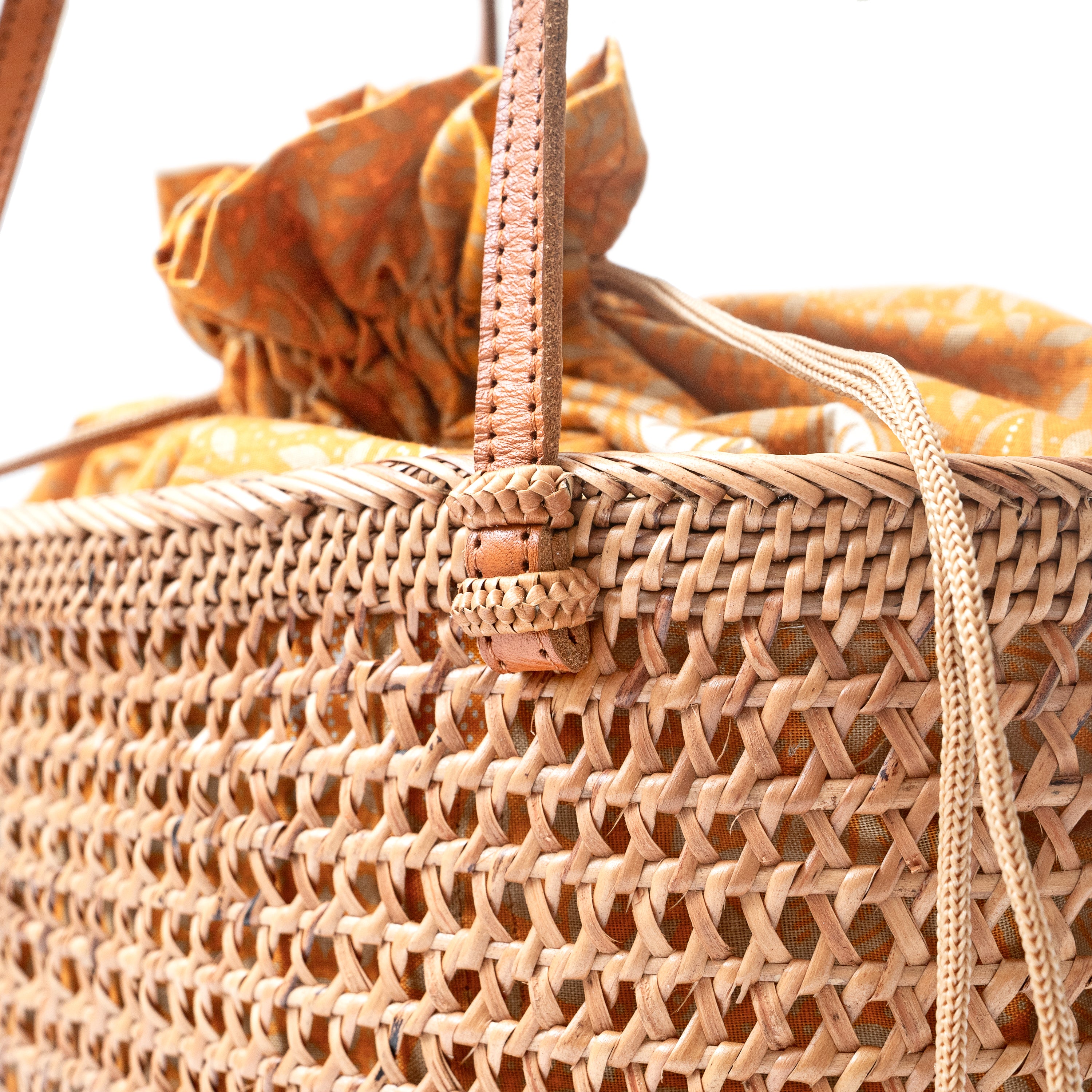 Detail view honey brown open weave mesh wicker basket shoulder tote handbag