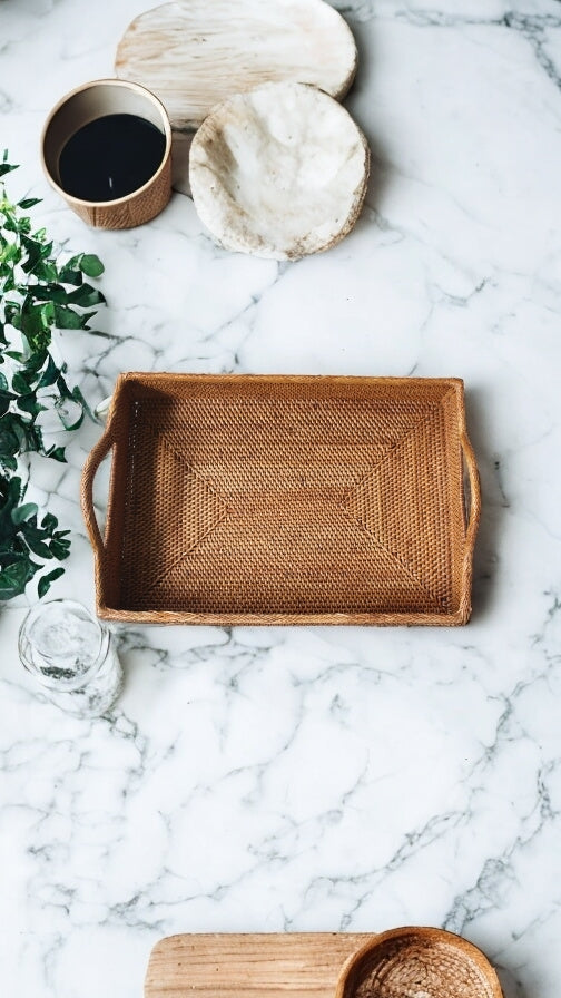honey rattan rectangle serving with on marble counter