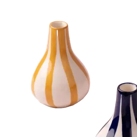 Vase with yellow and white stripes on a white background