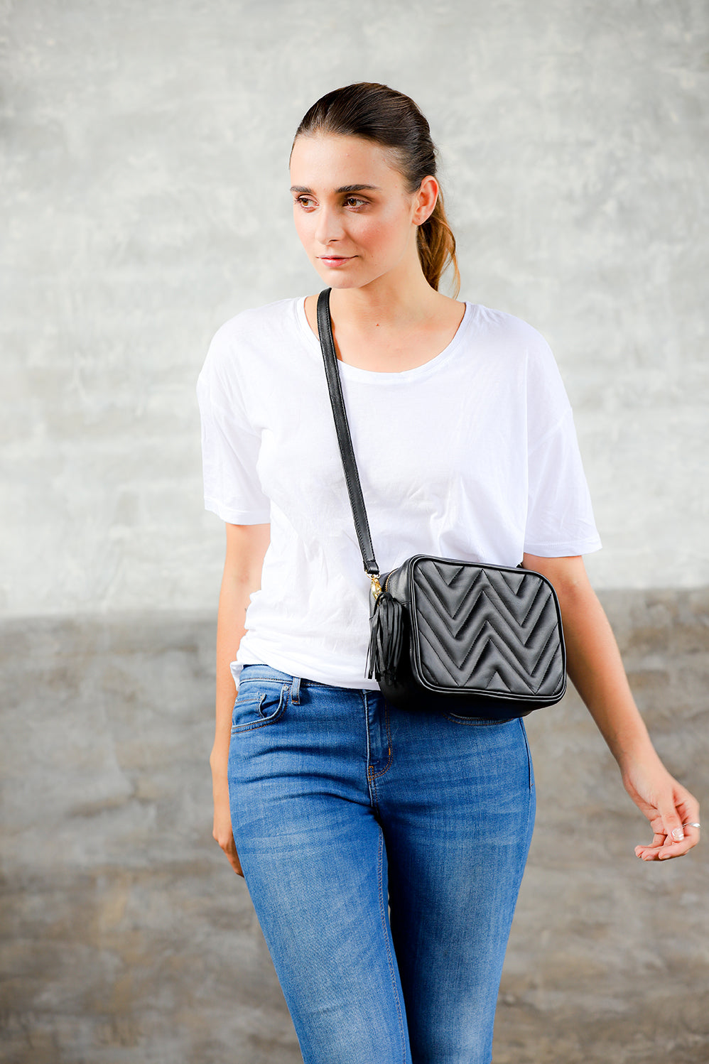 Model wearing Black Leather Crossbody Camera Bag