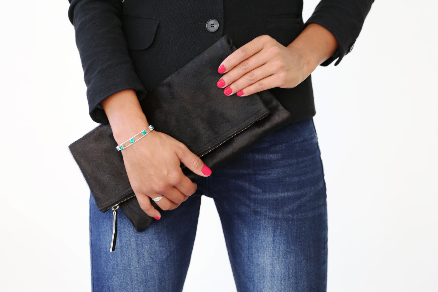 Model holding Calf Hair Leather Foldover Clutch