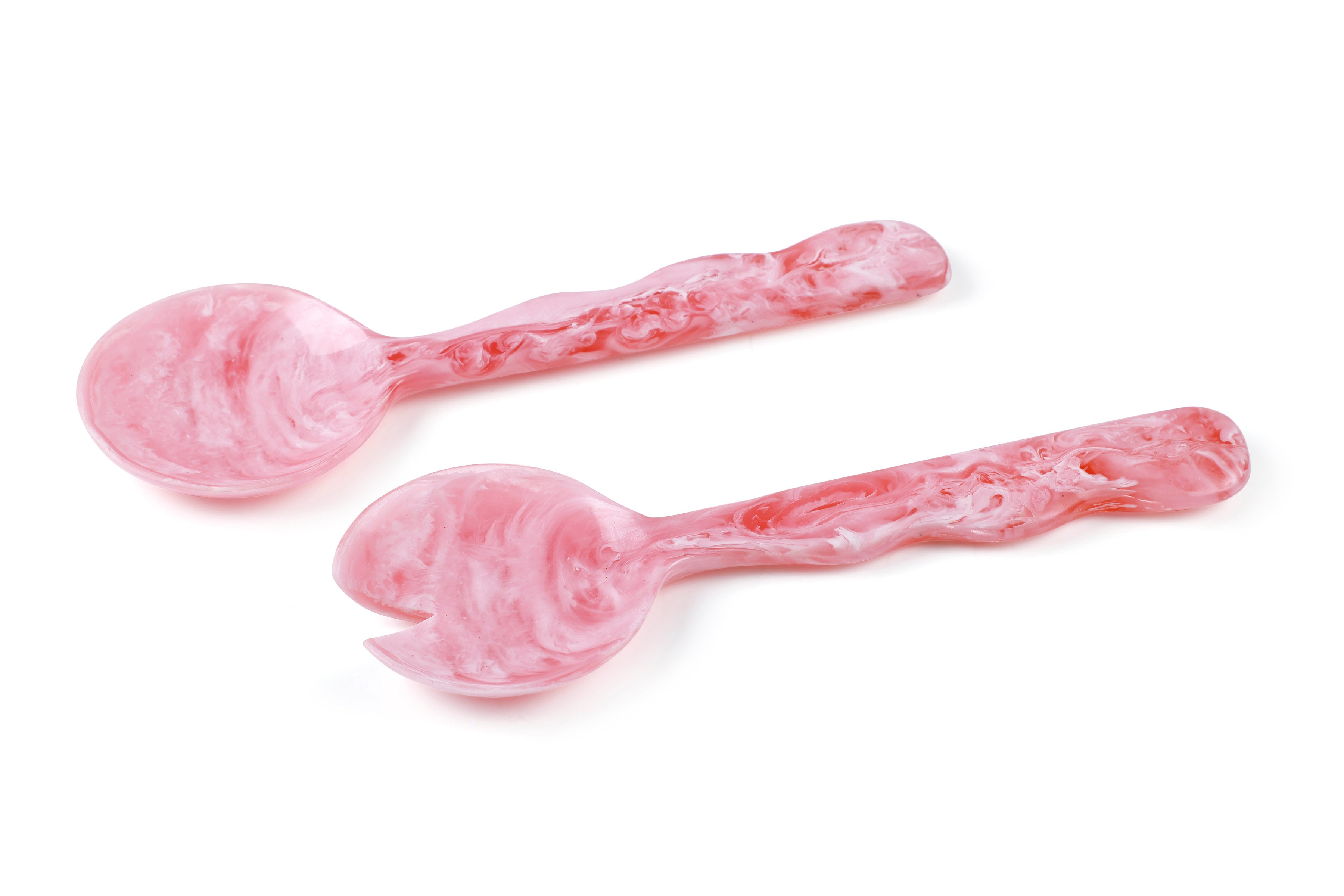 Two pink marbled spoons on a white background