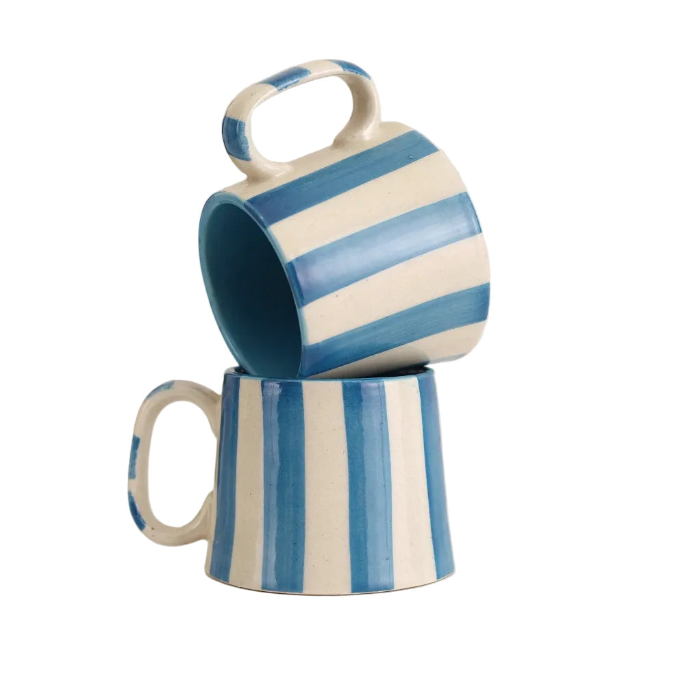 Two blue and white striped mugs stacked on a white background