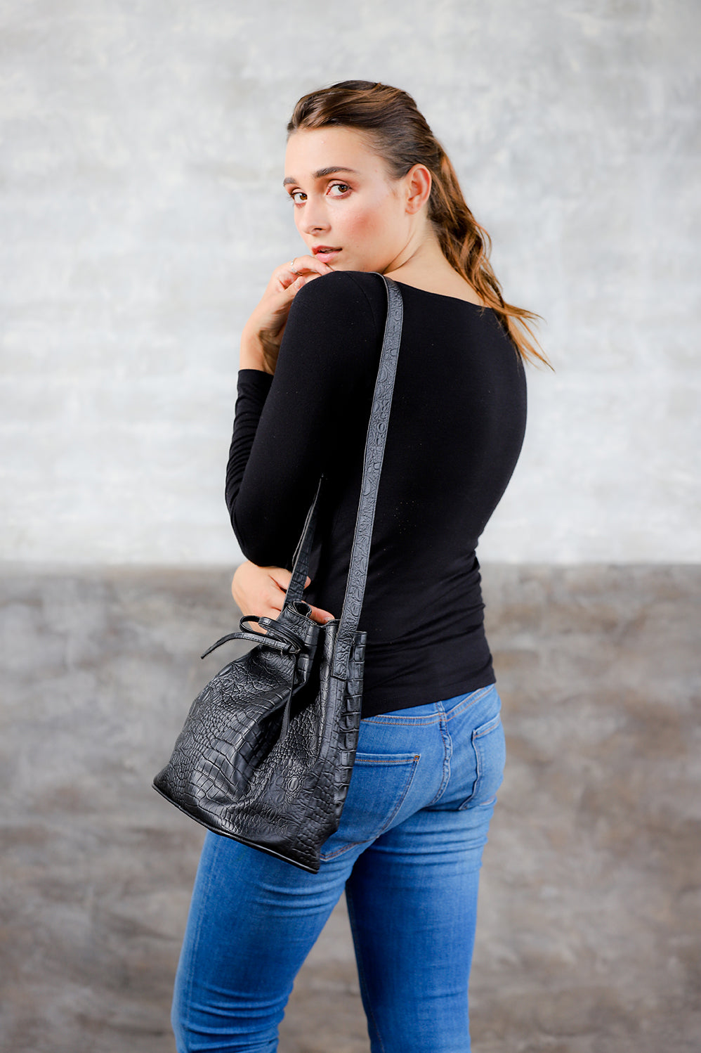 Model wearing side view Crocodile Embossed Leather Crossbody Shoulder Bucket Bag for Women