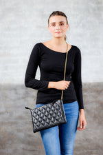 black leather clutch; bags and purses; black quilted leather bag; mz wallace quilted leather metro clutch bag.; black mz wallace quilted leather metro clutch bag; crossbody quilted clutch bag; black crossbody quilted bag; black matelasse leather bag; black matelasse crossbody handbag