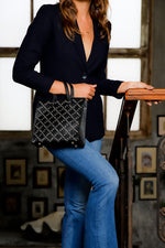 studded grommet black tote; small black cow leather tote; black tote handbag; black crossbody tote handbag; studded black crossbody handbag