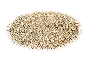 Side view of round woven cowrie shell border placemat