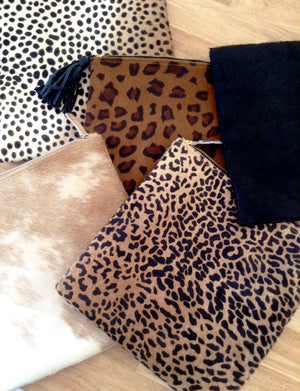 Group shot of leopard foldover women clutch bag 
