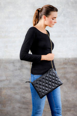 black leather clutch; bags and purses; black quilted leather bag; mz wallace quilted leather metro clutch bag.; black mz wallace quilted leather metro clutch bag; crossbody quilted clutch bag; black crossbody quilted bag; black matelasse leather bag; black matelasse crossbody handbag